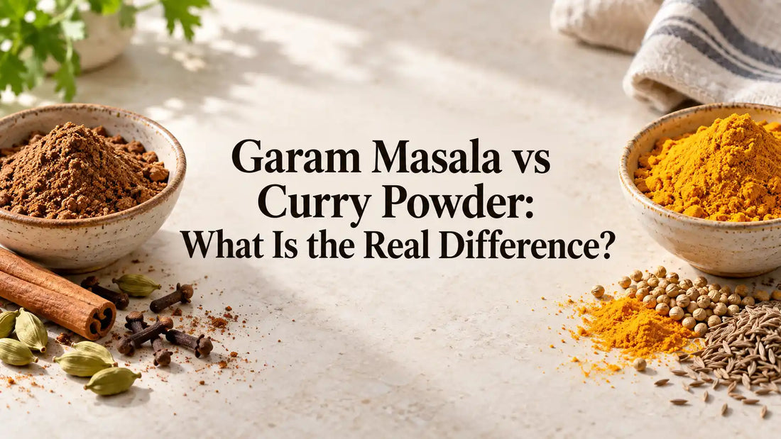 Brown garam masala and golden curry powder with whole spices, framing the title Garam Masala vs Curry Powder: What Is the Real Difference?