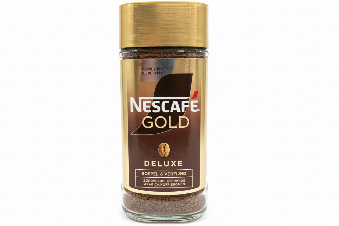 Nescafe Gold coffee jar on a white surface