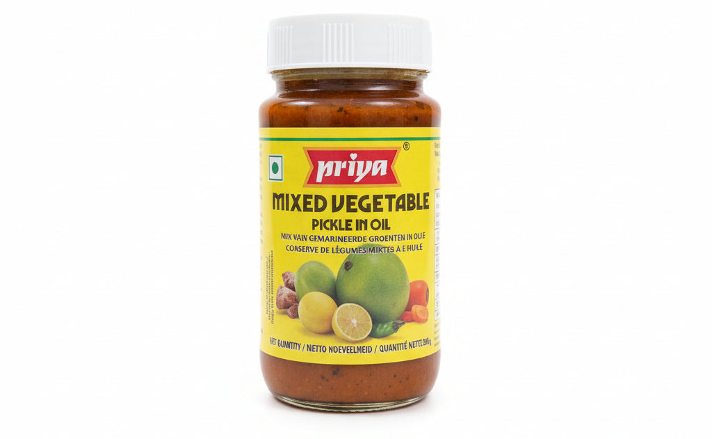 Jar of Ariya Mixed Vegetable Pickle on a shelf with a blurred background