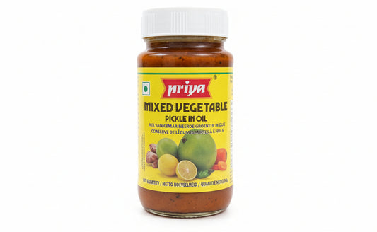 Jar of Ariya Mixed Vegetable Pickle on a shelf with a blurred background