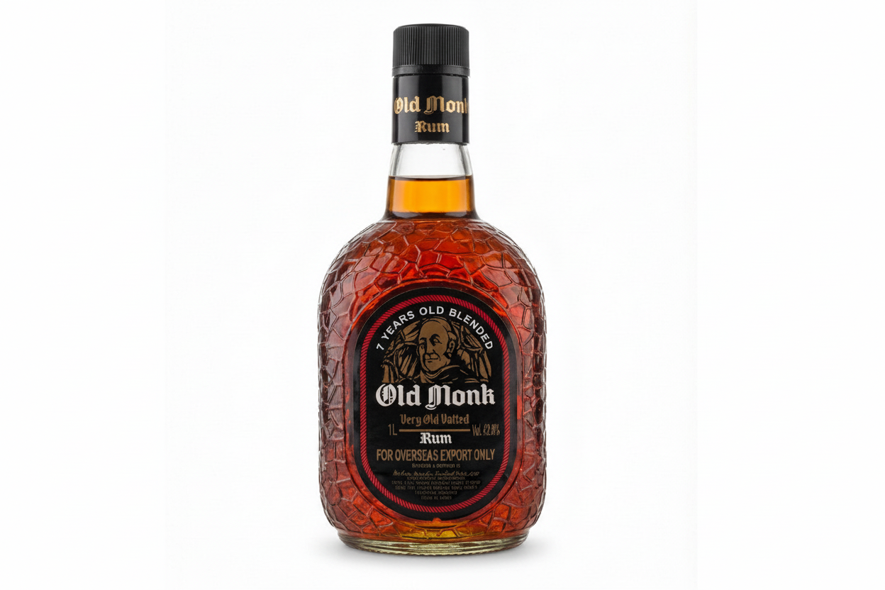 Bottle of Old Monk rum on a white background